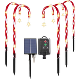 Solar-powered Christmas candy cane lights with solar panel in white background.