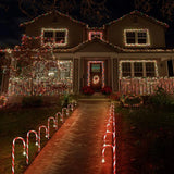 House decorated with candy lane Christmas outdoor lights.