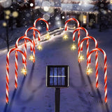 candy lane pathway lights with solar panel in snow.