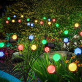 Multicolor LED firefly lights in yard