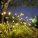 Warm white LED firefly lights surrounded by bushes and trees.