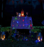 garden table with colored LED string lights outside