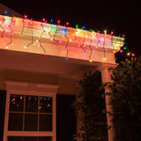 multicolor icicle lights suspended on roofline
