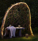 warm white LED string lights in a garden