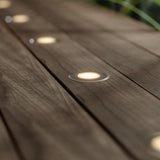 recessed deck lights on wooden surface